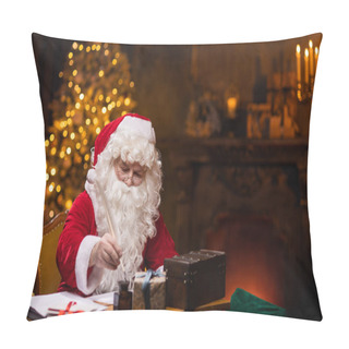 Personality  Workplace Of Santa Claus. Cheerful Santa Is Writing The Letter While Sitting At The Table. Fireplace And Christmas Tree In The Background. Christmas Concept. Pillow Covers