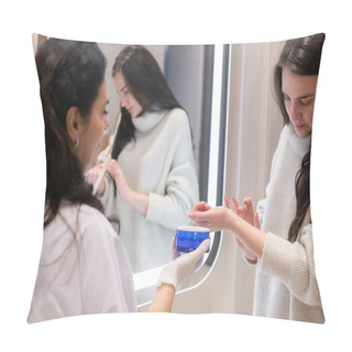 Personality  Two Women, A Beautician Doctor And A Client, Stand At The Mirror, For A Consultation, The Doctor Applies Cream To The Woman's Hands And Makes A Light Massage Pillow Covers