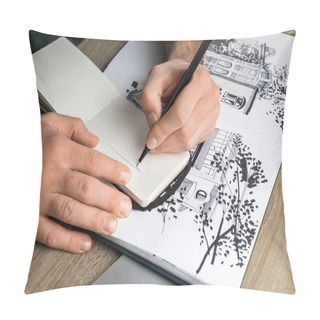 Personality  Selective Focus Of Mans Hands Drawing In Notebook On Wooden Table Next To Album Pillow Covers