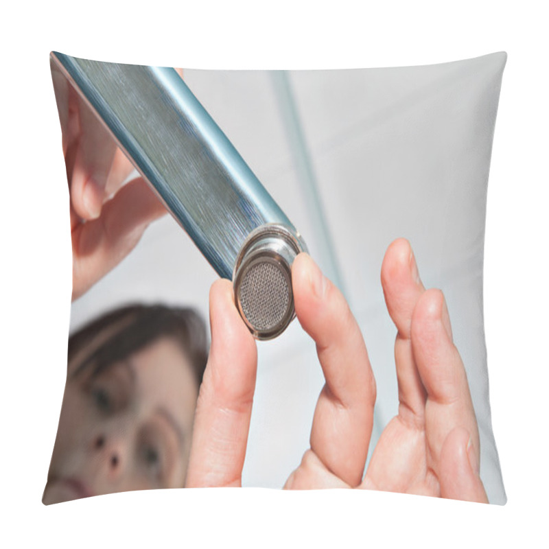 Personality  Unscrewing a faucet aerator for cleaning. pillow covers