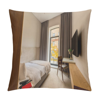Personality  Tv Flat Screen On Wall Near Workspace And Bed In Hotel Room  Pillow Covers