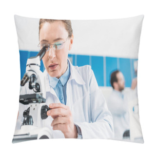 Personality  Selective Focus Of Female Scientist Looking Thorough Microscope On Reagent With Colleague Behind In Lab Pillow Covers