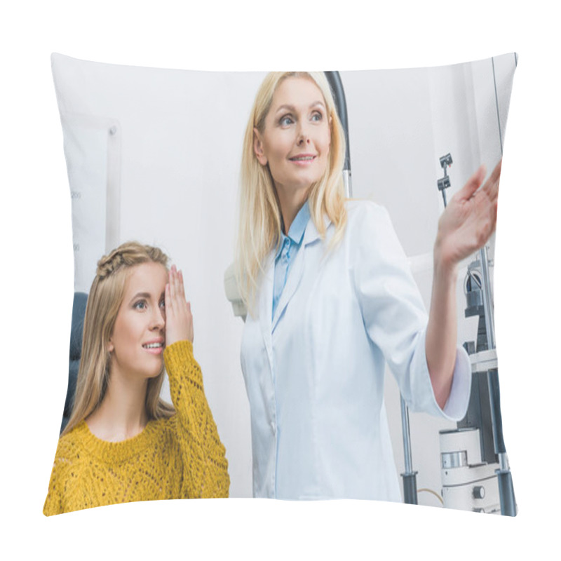 Personality  Oculist Gesturing While Examining Beautiful Patient In Clinic Pillow Covers