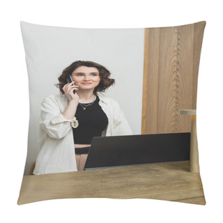 Personality  Happy Concierge With Wavy Brunette Hair And Tattoo Wearing Stylish Clothes And Talking On Telephone At Reception Desk Near Computer Monitor And Lamp In Lobby Of Modern Hotel, Customer Service Pillow Covers