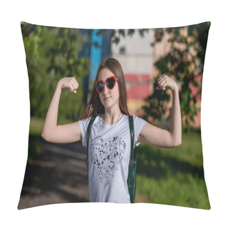 Personality  A Teenage Girl Jokingly Shows Her Biceps On Her Hands. A Bright Sunny Day In The Park. In Sunglasses In Form Of Red Hearts. Emotions Of The Power Of Female Courage. Teenager After School. Pillow Covers