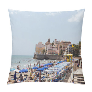 Personality  CATALONIA, SPAIN - APRIL 30, 2020: People Resting On Beach With Umbrellas, Buildings And Blue Sky At Background  Pillow Covers