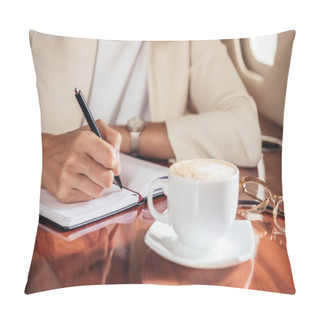 Personality  Cropped View Of Businesswoman In Suit Writing In Notebook In Private Plane  Pillow Covers