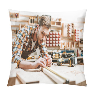 Personality  Selective Focus Of Handsome Woodworker Holding Pencil While Measuring Wooden Plank  Pillow Covers