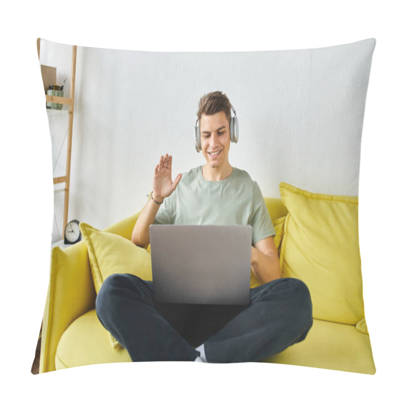 Personality  cheerful student with headphones and laptop in yellow couch saying hello to online meeting pillow covers