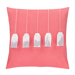 Personality  Top View Of Five Unused Tea Bags Isolated On Red Pillow Covers