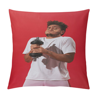 Personality  Curly African American Man Working Out With Heavy Dumbbell And Puffing Cheeks On Red Background Pillow Covers