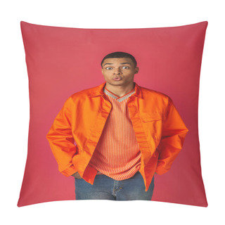 Personality  Discouraged African American Man Pouting Lips And Looking At Camera On Red, Orange Shirt, Stylish Pillow Covers