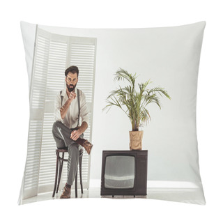 Personality  Handsome Bearded Man Sitting On Chair Near Folding Screen And Tv In White Room Pillow Covers