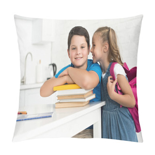 Personality  Portrait Of Smiling Boy At Table With Books And Little Sister With Backpack Telling Secret Near By At Home Pillow Covers