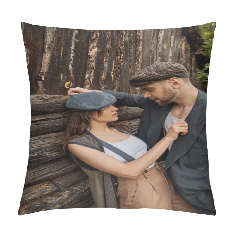 Personality  Fashionable And Passionate Woman In Suspenders And Newsboy Cap Touching Jacket Of Bearded Boyfriend While Standing Together Near Rustic House, Stylish Couple In Rural Setting Pillow Covers