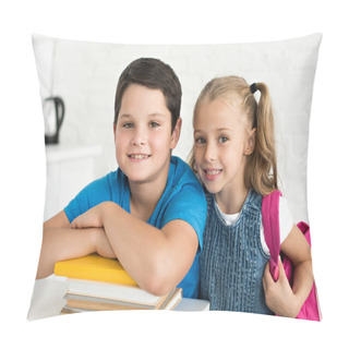 Personality  Portrait Of Smiling Boy At Table With Books And Little Sister With Backpack Near By At Home Pillow Covers