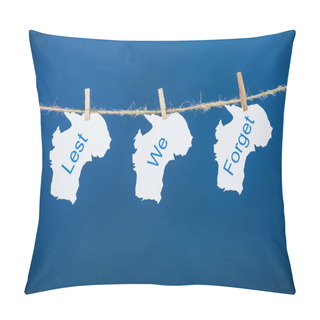 Personality  Rope, Clothespins And Papers With Lest We Forget Lettering On Blue Pillow Covers