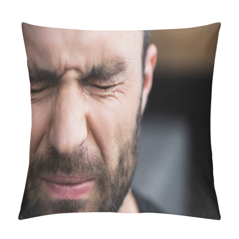 Personality  portrait of handsome bearded man crying with closed eyes with tears on face pillow covers