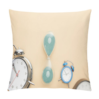 Personality  Top View Of Classic Alarm Clocks And Hourglass On Beige Background Pillow Covers