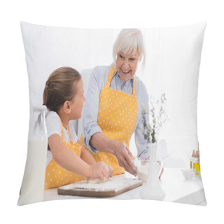 Personality  Cheerful Granny Holding Flour And Looking At Kid With Dough On Blurred Foreground In Kitchen  Pillow Covers
