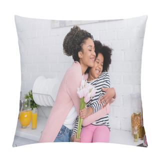 Personality  Pleased African American Woman Embracing Daughter Sitting On Kitchen Counter With Tulips Pillow Covers