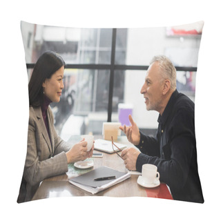 Personality  Side View Of Businessman And Smiling Asian Businesswoman Talking In Cafe  Pillow Covers