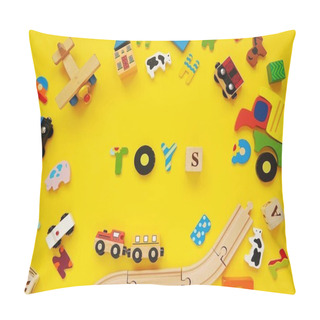 Personality  Word TOYS And Frame With Colorful Wooden Kids Toys On Yellow Background. Pillow Covers