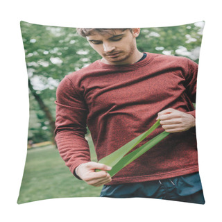 Personality  Handsome Sportsman Holding Elastics Band While Working Out In Park  Pillow Covers