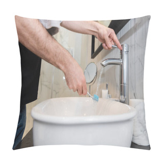 Personality  Cropped View Of Man Holding Toothbrush Under Water In Bathroom Pillow Covers