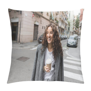 Personality  Positive Young And Curly Woman In Casual Jacket Holding Coffee In Paper Cup And Looking Away On Blurred City Street With Cars And Buildings At Daytime In Barcelona, Spain  Pillow Covers