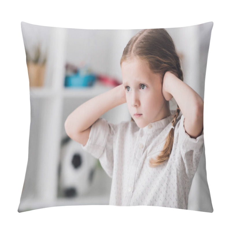 Personality  close-up portrait of little child covering ears with hands and looking away pillow covers