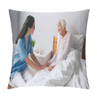 Personality  Geriatric Nurse In Glasses Talking With Smiling Aged Woman In Bed Pillow Covers