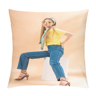 Personality  Beautiful Stylish Girl In Jeans, Yellow T-shirt, Sunglasses, Heeled Sandals And Silk Scarf Sitting On White Cube On Beige Pillow Covers