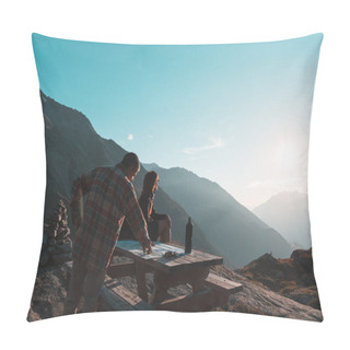Personality  Coouple Hikers Reading Trekking Map On Table In Backlight, Rear View. Adventure Exploration On The Alps. Pillow Covers