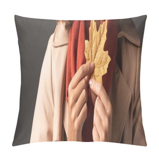 Personality  Panoramic Shot Of Woman In Trench Coat Holding Golden Maple Leaf On Black Background Pillow Covers