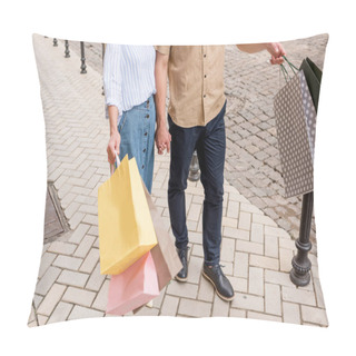 Personality  Cropped Image Of Stylish Couple Of Shoppers With Paper Bags Standing On Street Pillow Covers