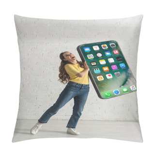 Personality  KYIV, UKRAINE - FEBRUARY 21, 2020: Positive Woman Holding Big Model Of Smartphone With Iphone Screen At Home  Pillow Covers