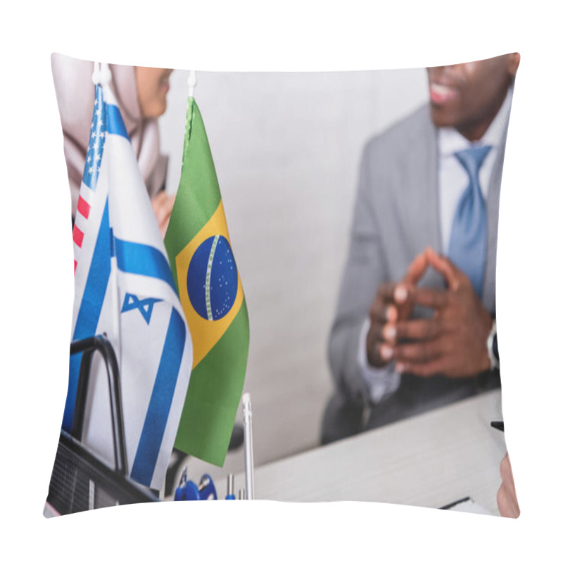 Personality  Selective Focus Of Brazilian, American And Uae Flags Near Arabian And African American Business Partners On Blurred Background, Cropped View Pillow Covers