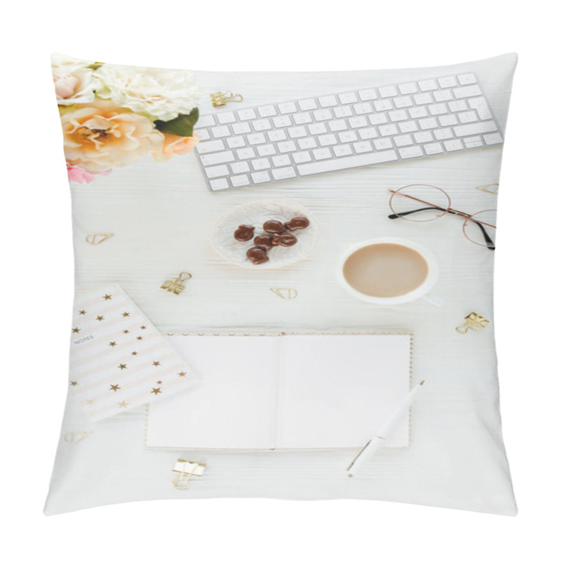 Personality  Flat lay womens office desk. Female workspace with computer, pink roses flowers, accessories, golden diary, glasses on white background. Top view  pillow covers