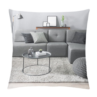 Personality  Modern Monochrome Living Room With A Charcoal Grey Modular Sofa Adorned With Geometric And Velvet Pillows, A Round Metal Coffee Table, Textured Pouf, On A Shaggy Beige Rug, Sleek Console Table Accents Pillow Covers