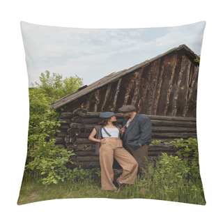 Personality  Fashionable Woman In Vintage Outfit Touching Suspender While Standing And Looking At Bearded Boyfriend In Newsboy Cap Near Rural House On Meadow, Fashion-forward In Countryside Pillow Covers