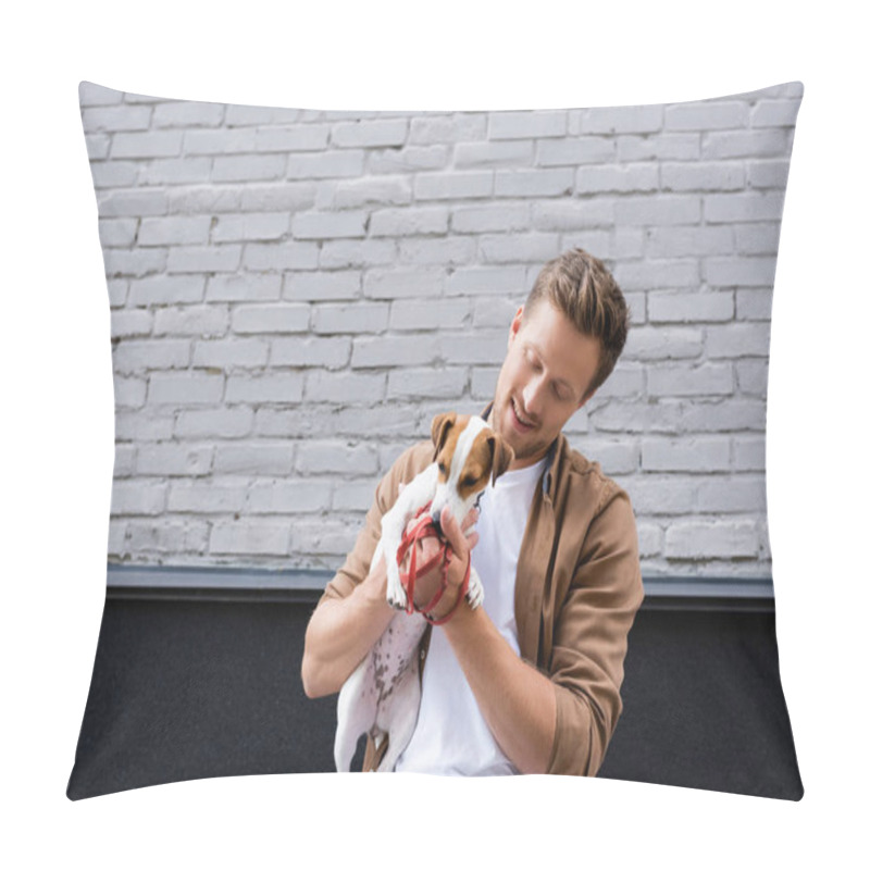 Personality  Man holding on hands jack russell terrier and leash on urban street  pillow covers