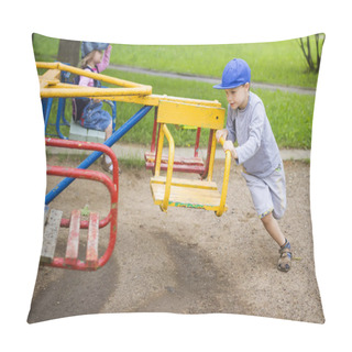 Personality  Little Children Roll Each Other On Carousels Swings On The Children's Playground In The Yard. A Boy And A Girl Ride On The Carousel. Children's Fun. Happy Smiling Kids. Pillow Covers