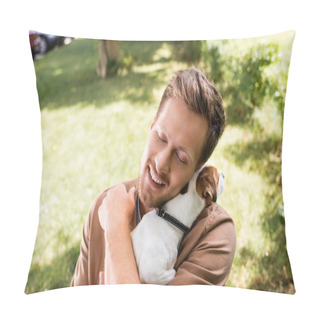 Personality  Young Man With Closed Eyes Holding And Cuddling Jack Russell Terrier Dog In Park Pillow Covers