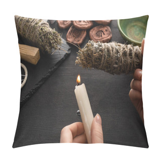 Personality  Cropped View Of Shaman Holding Candle And Smudge Stick Near Witchcraft On Black Wooden Background Pillow Covers