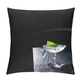 Personality  High Angle View Of Cocktail Glass With Drink With Ice Cubes, Mint Leaf And Whole Lime On Blue Wooden Surface On Black Background With Geometric Lines Pillow Covers
