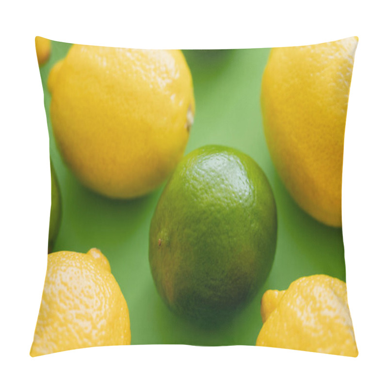 Personality  Close up view of ripe lime and lemons on green background pillow covers