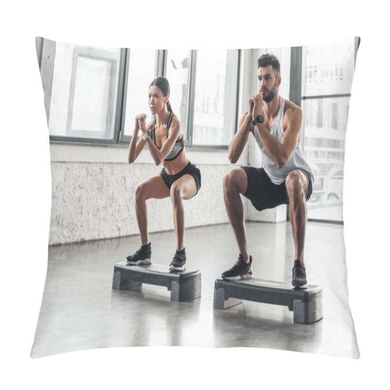 Personality  Concentrated Athletic Young Couple In Sportswear Squatting On Step Platforms In Gym Pillow Covers