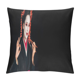 Personality  Smiling Beautiful Geisha In Black Kimono With Red Flowers In Hair Holding Chopsticks And Showing Okay Sign Isolated On Black, Panoramic Shot Pillow Covers