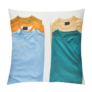 Personality  Top View Of Beige, Orange, Blue, Turquoise And Ochre T-shirts On White Background Pillow Covers
